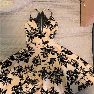 Teen dress size xs. Gold tone with black flowers.